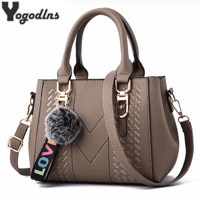Elegant embroidered PU leather women’s handbag with pom-pom charm and shoulder strap in multiple colors
