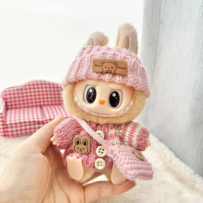 Labubu 17cm doll wearing pink knitted sweater, hat and matching bag outfit