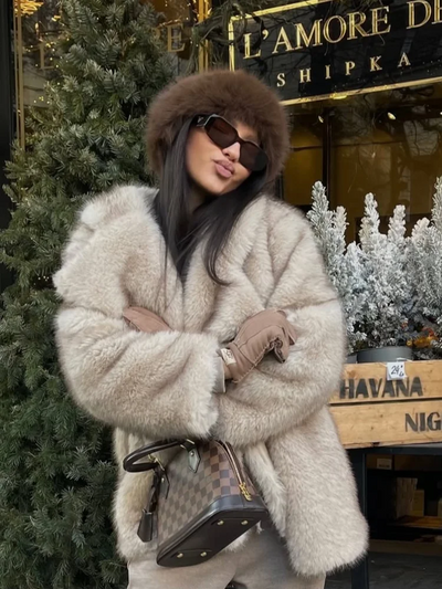 Woman wearing solid color faux fur lapel jacket – chic winter 2025 outerwear
