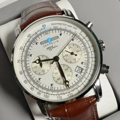 Zeppelin 100 Jahre luxury men’s chronograph watch with ivory dial, date display, tachymeter, and brown leather strap