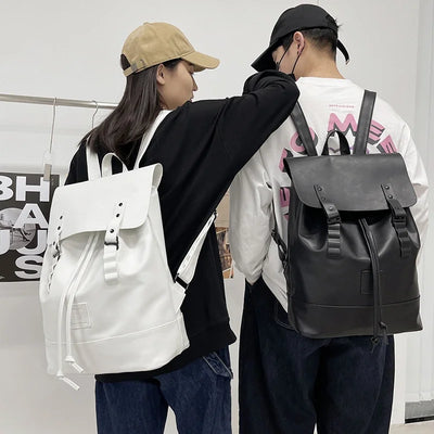Unisex PU leather backpack in black and white with large capacity and multiple pockets for school, work, or travel