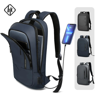 Slim waterproof laptop backpack with USB charging port, navy and black design, fits 15.6-inch laptop