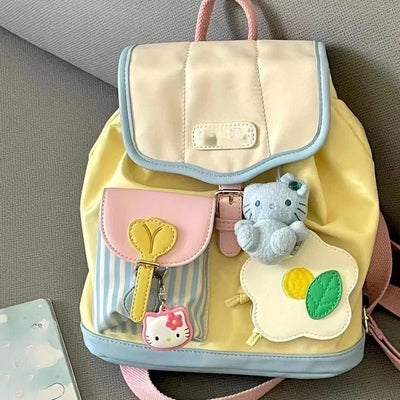Mini pastel color block backpack with Hello Kitty charm and plush toy – ideal for girls, travel, and university use