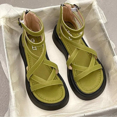 Green women’s strappy Roman sandals with open toe and chunky flat sole – stylish summer footwear