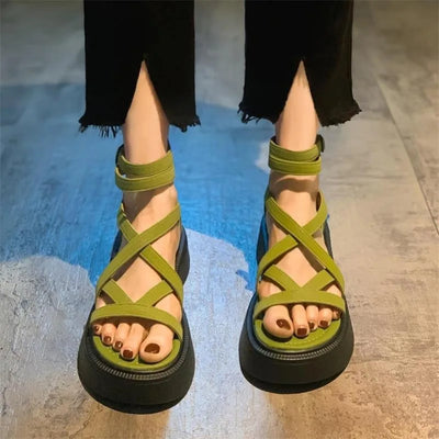 Women’s green strappy Roman sandals with flat cushioned sole and ankle straps – casual summer open toe shoes