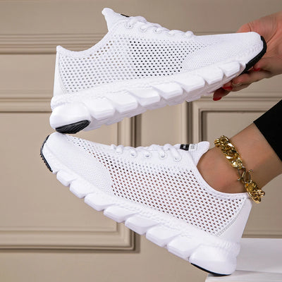 White women’s breathable mesh sneakers with hollow-woven design, lightweight EVA sole, and lace-up closure for running and casual wear
